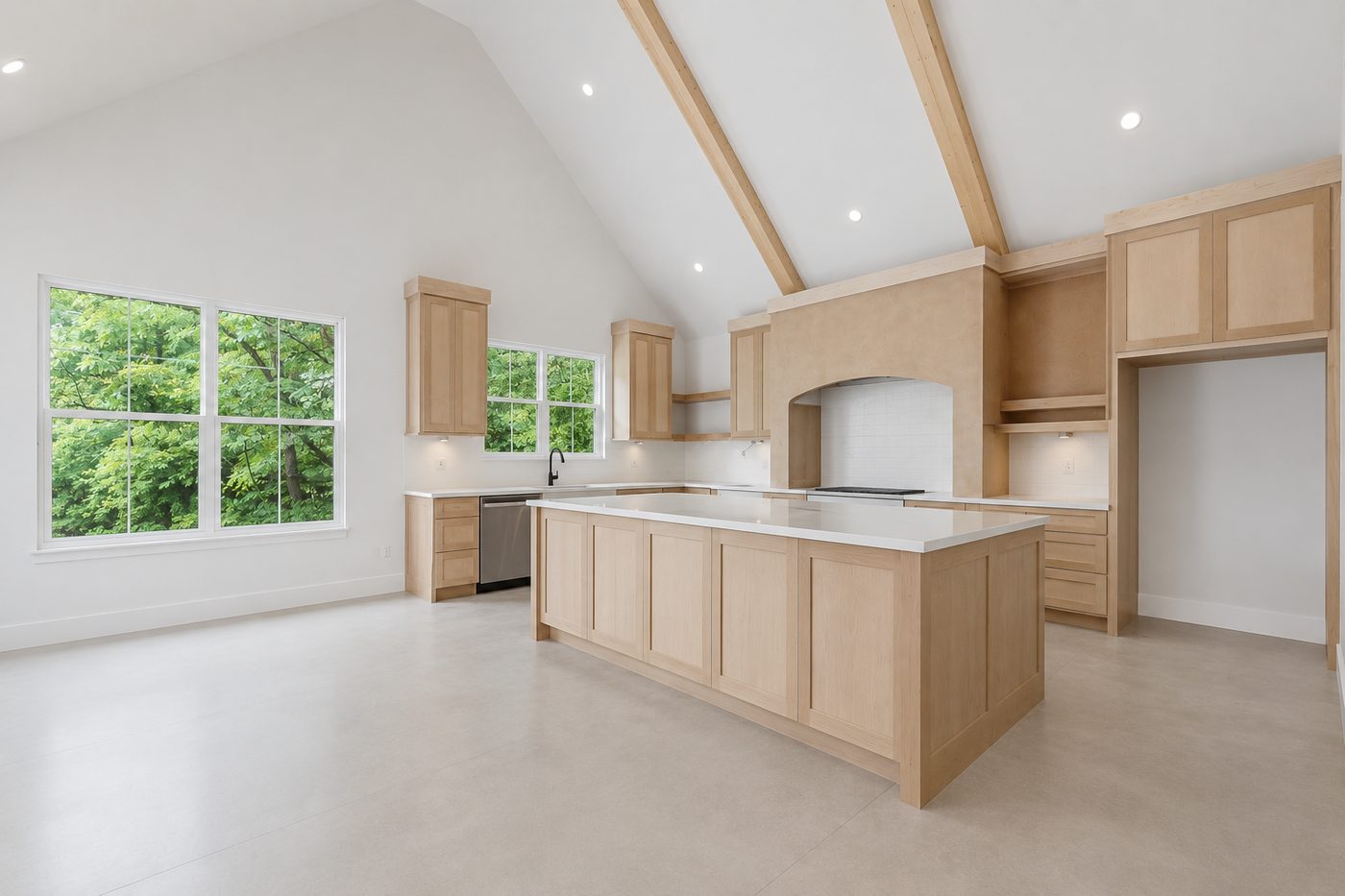 Finished kitchen with vaulted ceiling and exposed beams